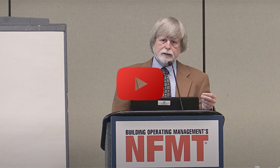 man speaking at conference