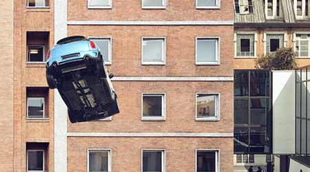 Car falling off of a building.