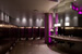 
By adding on existing large circular storage rooms into the bathroom's footprint, the restrooms now meet the Center's needs. LED panels cycle through the prism to add a theatrical touch to the space.
